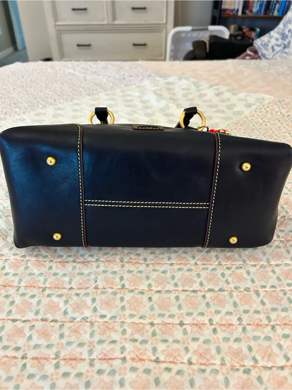 Dooney and Bourke Florentine Satchel 30 in the color Navy. EUC comes w/bag charm